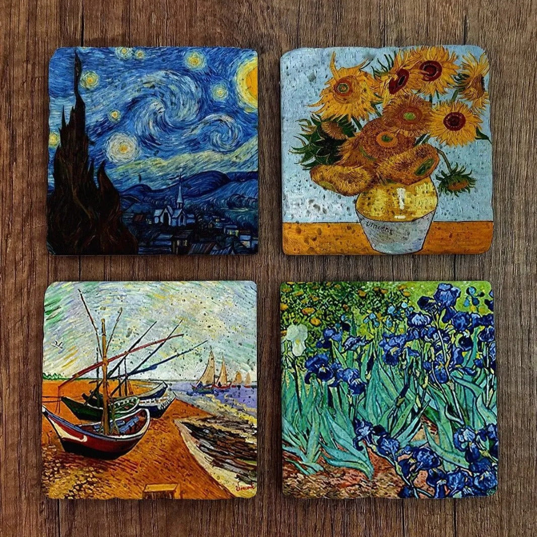 Four Van Gogh-themed coasters on a wooden surface