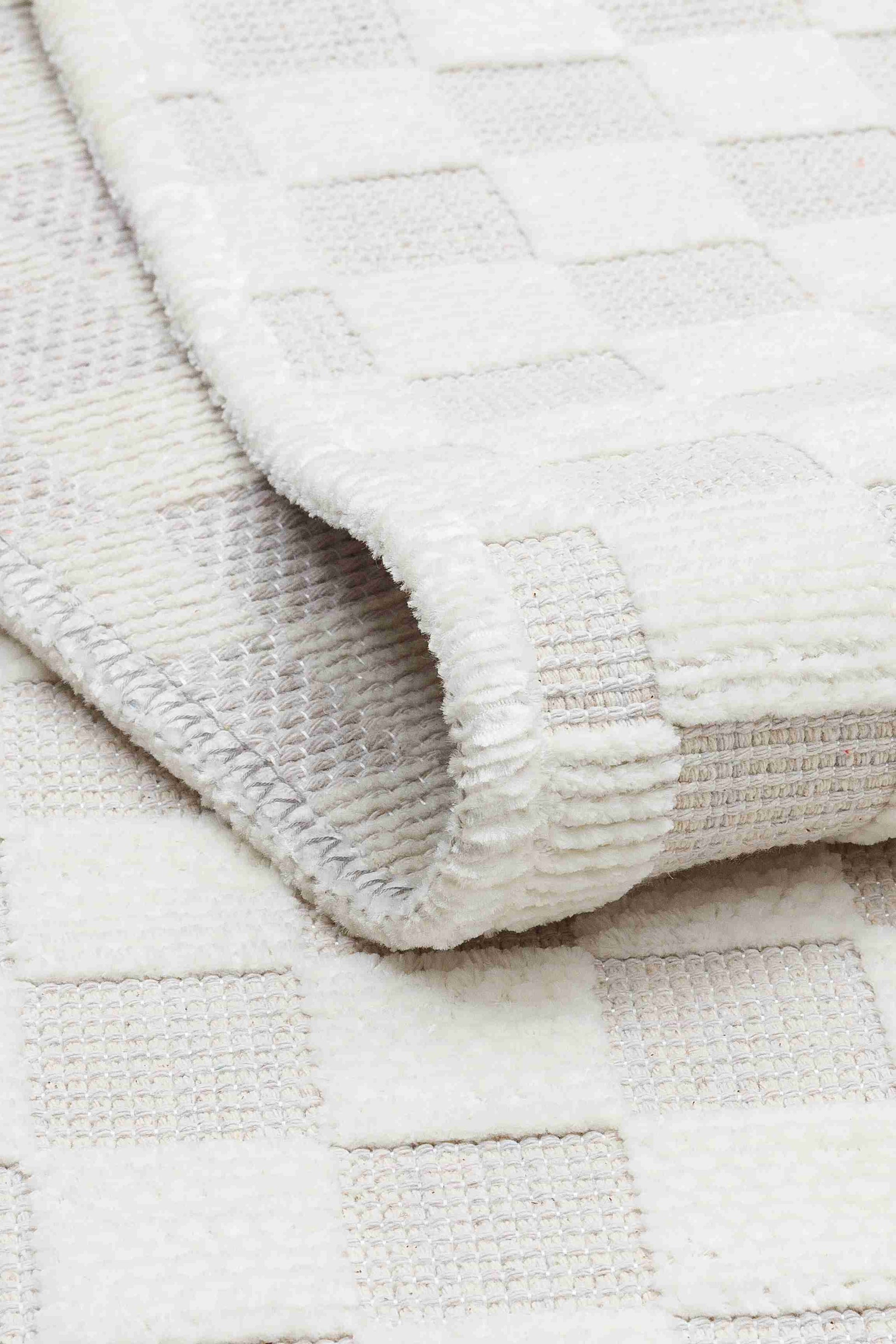 Ada Cream Rug - Folded to Show Pattern and Texture | Artistry Home