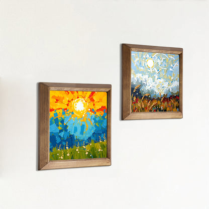 Two framed abstract paintings on a white wall