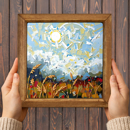 Framed abstract artwork with a wooden frame held by hands against a wooden background