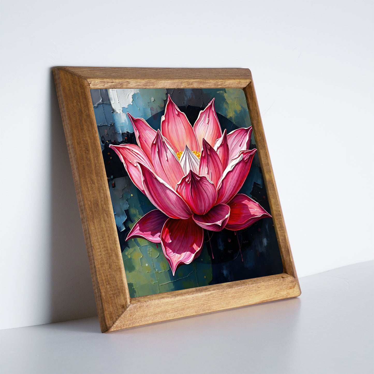 Framed artwork of a pink lotus flower on a white surface with a light gray background