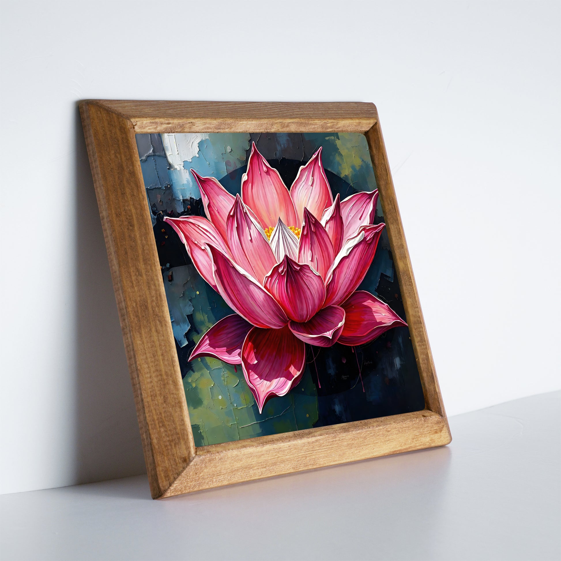 Framed artwork of a pink lotus flower on a white surface with a light gray background