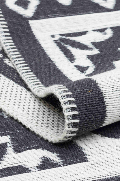 Arya Neo Black White Rug - Folded to Show Pattern and Texture | Artistry Home