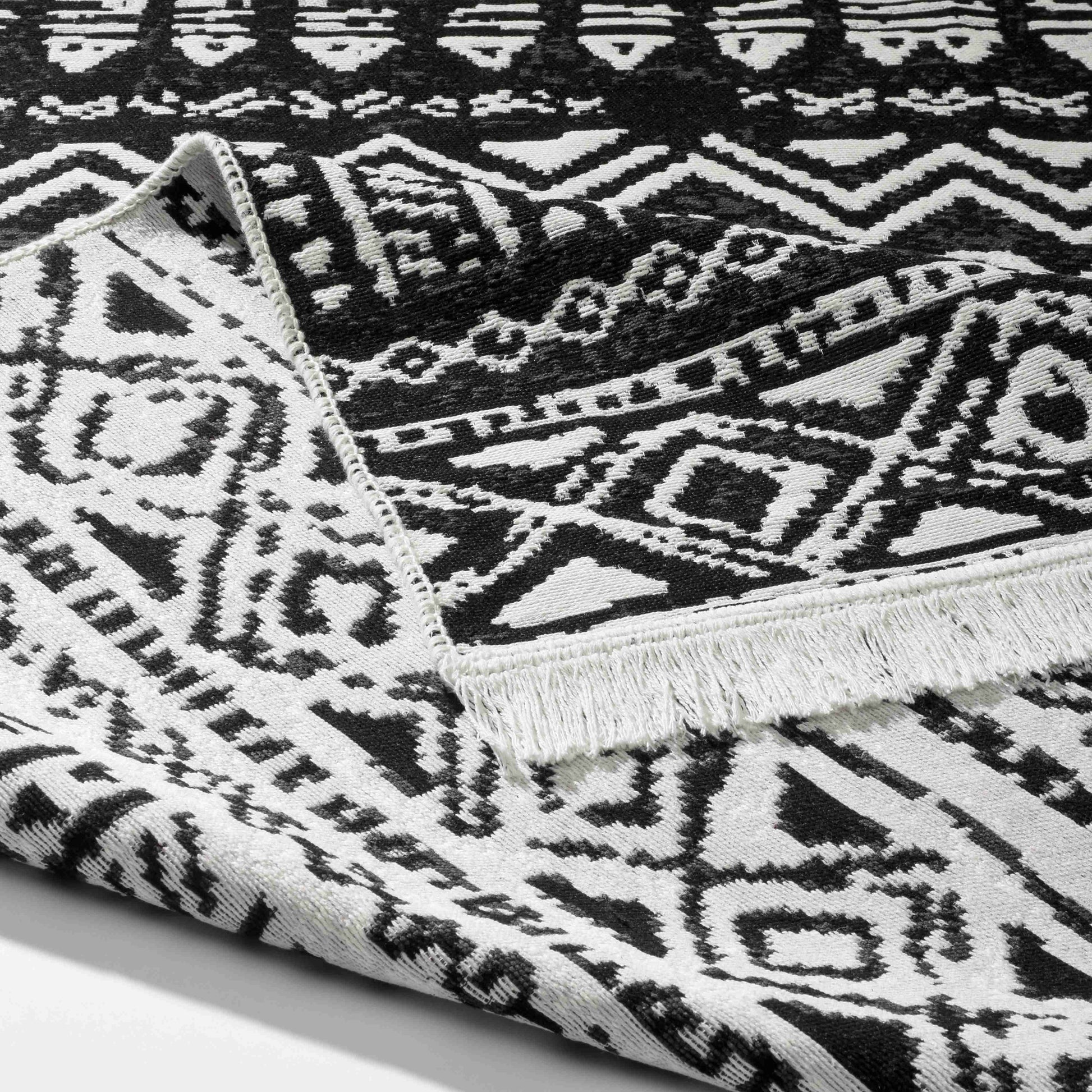 Arya Black Rug - Front and Back View | Artistry Home