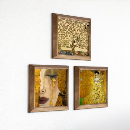 Three framed artworks inspired by Gustav Klimt on a white wall.