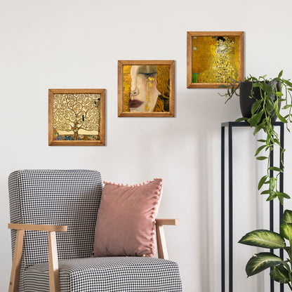 Decorative wall art above a chair with a pink pillow, against a white wall.