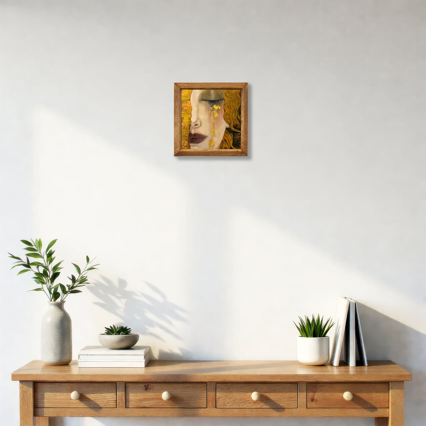 Wooden console table with decorative items against a white wall