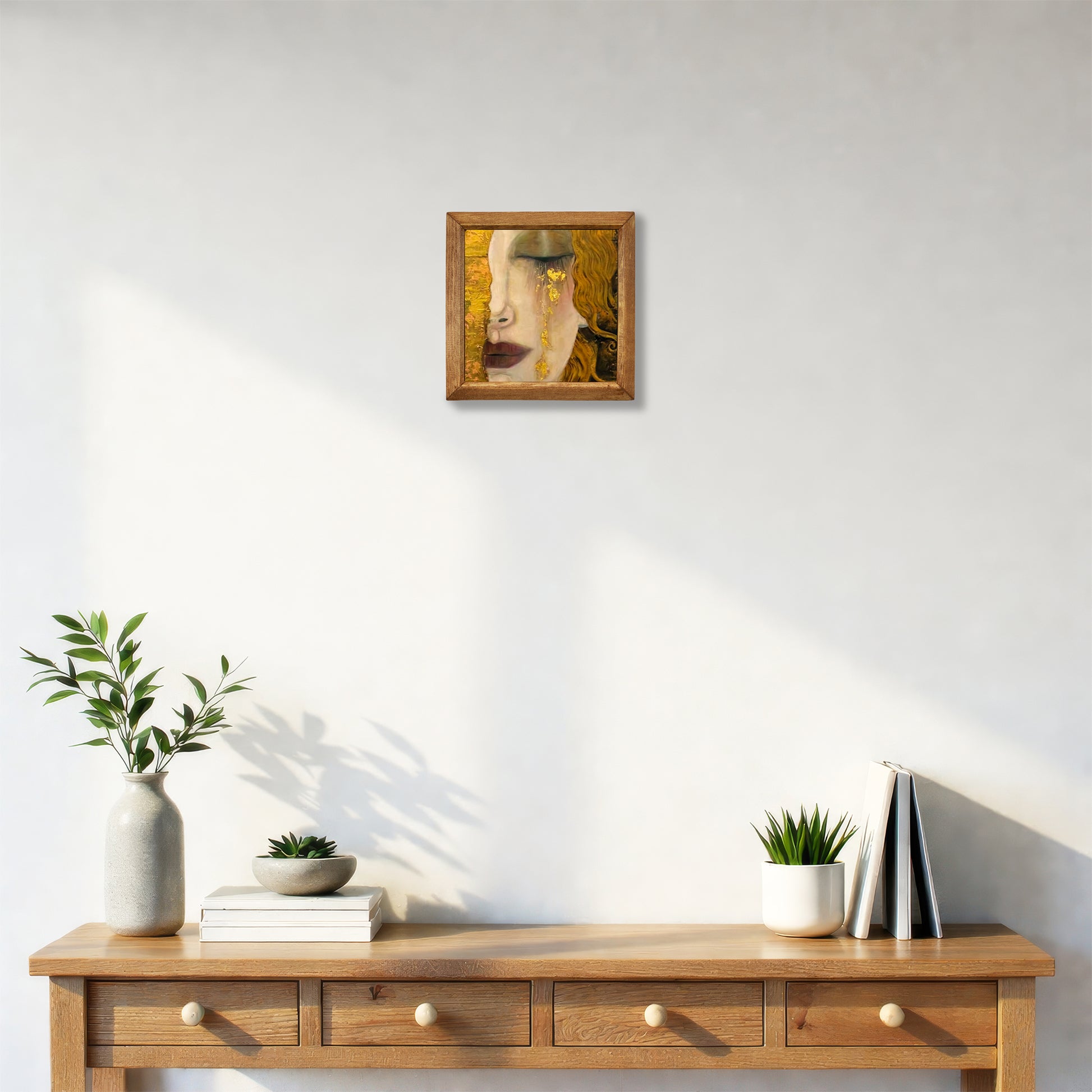 Wooden console table with decorative items against a white wall