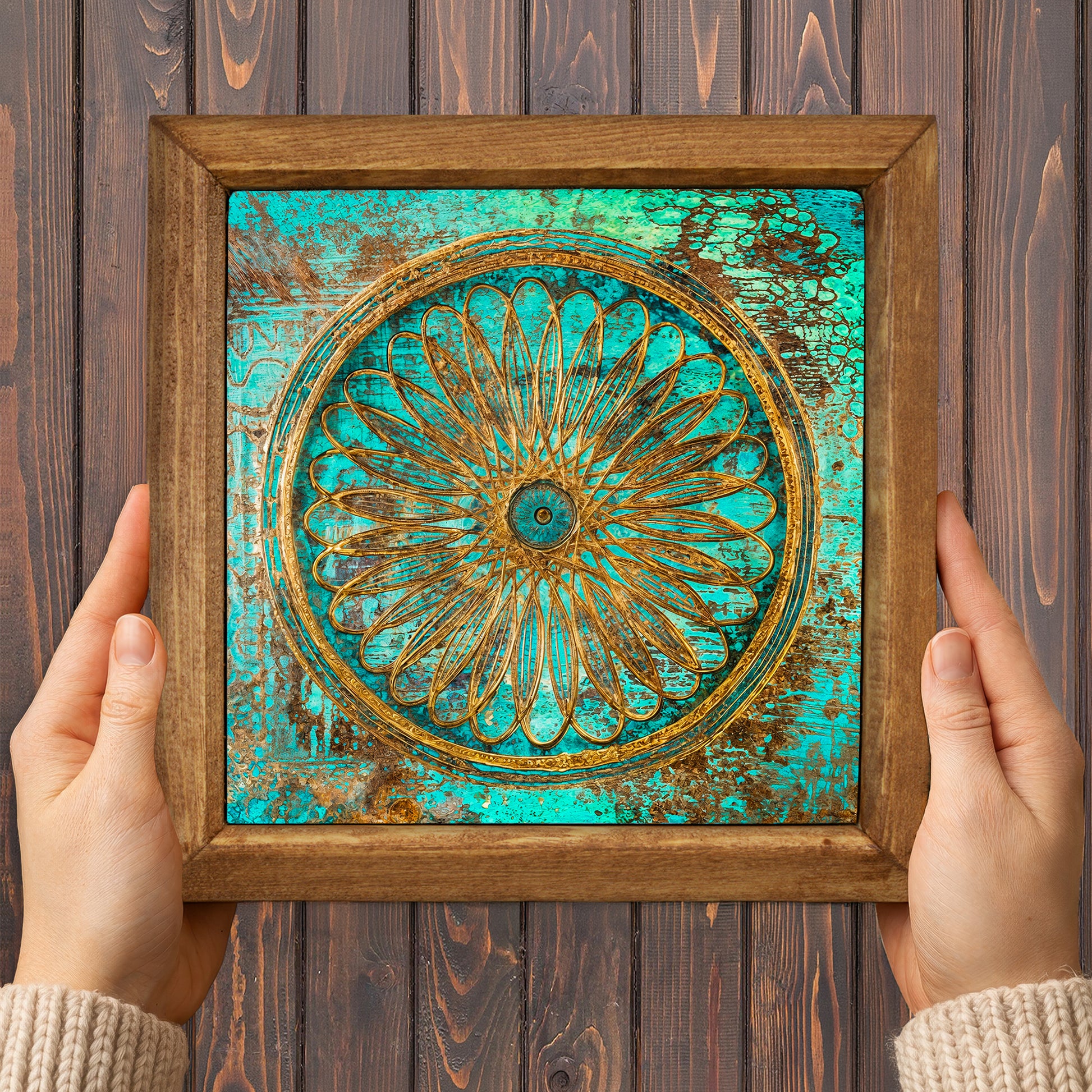 Framed decorative artwork with a floral design on a wooden background