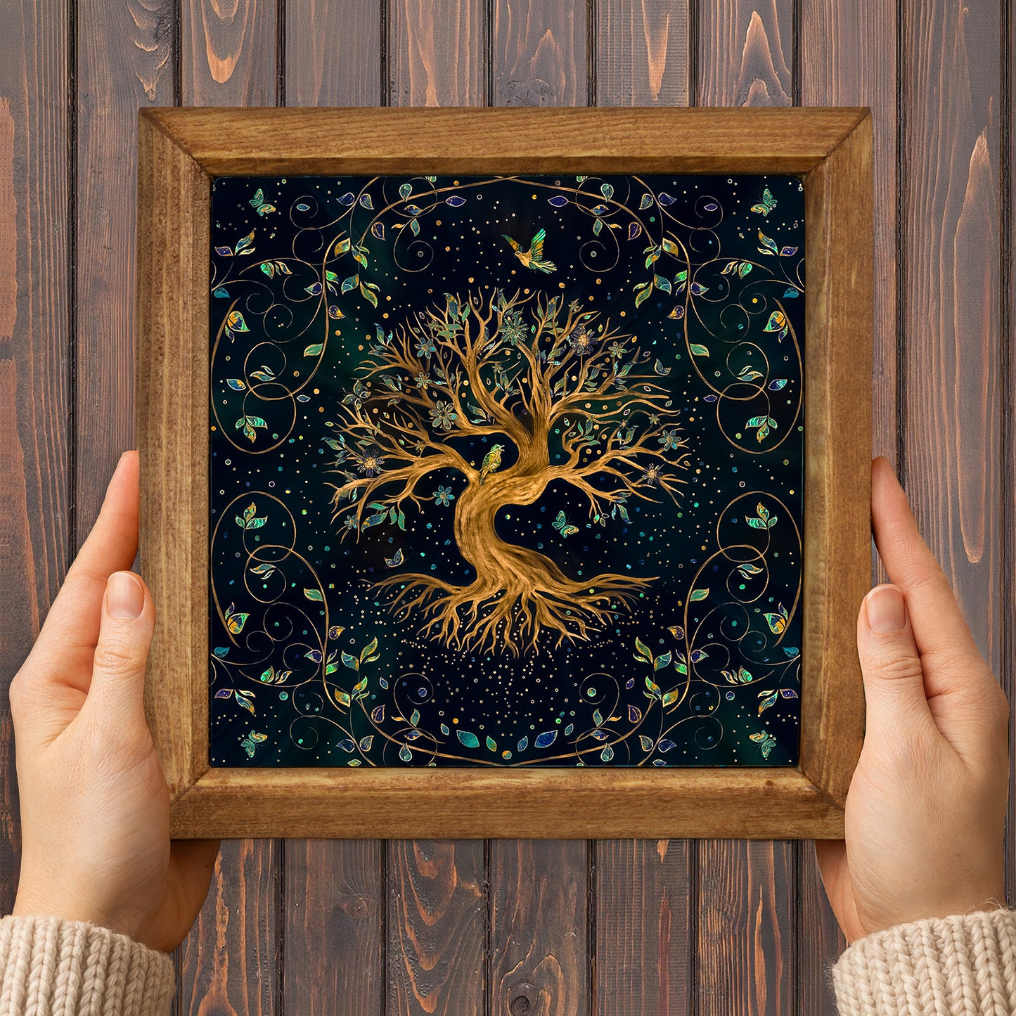 Framed artwork of a tree with intricate designs on a wooden background