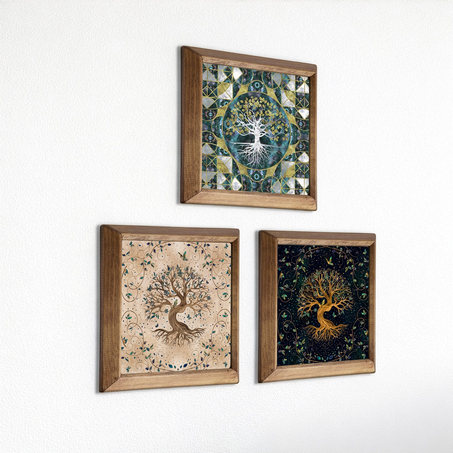 Three framed wall art pieces with tree designs on a white background