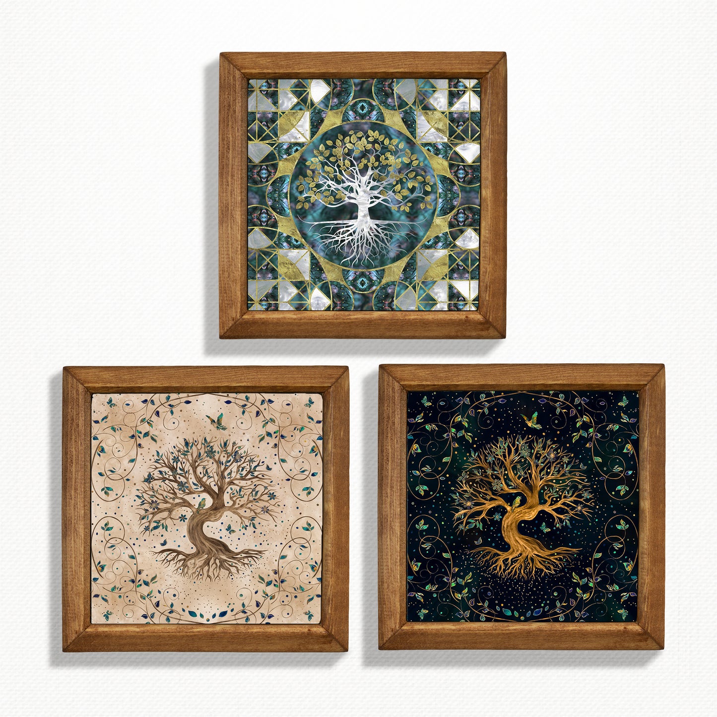 Three framed artworks of trees with intricate designs on a white background