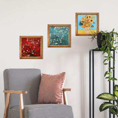 Decorative wall with framed artworks and a chair with cushions.