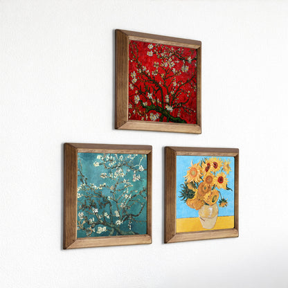 Set of three framed artworks resembling Van Gogh's style on a white wall.